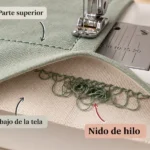 nido de hilo bajo la tela al coser
